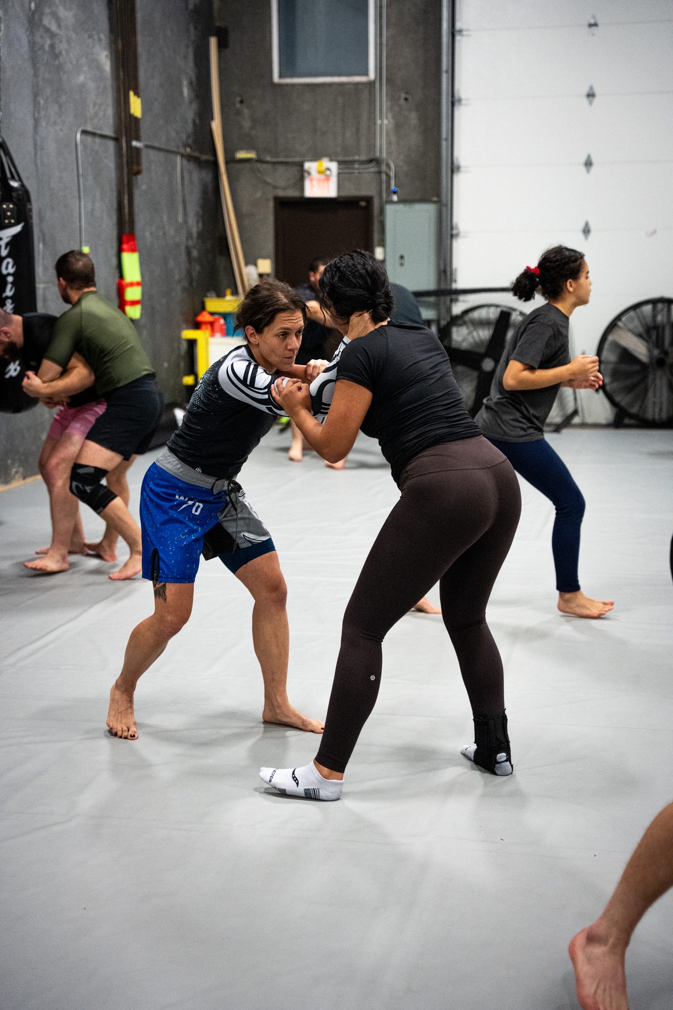 Partners drilling a practical self defence clinch during class at Mission BJJ in Mission, BC